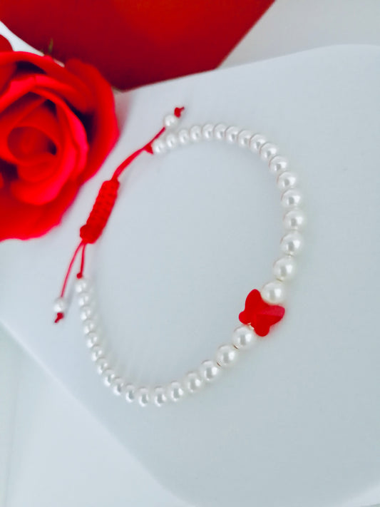 Bracelet réglable en perles et papillon rouge