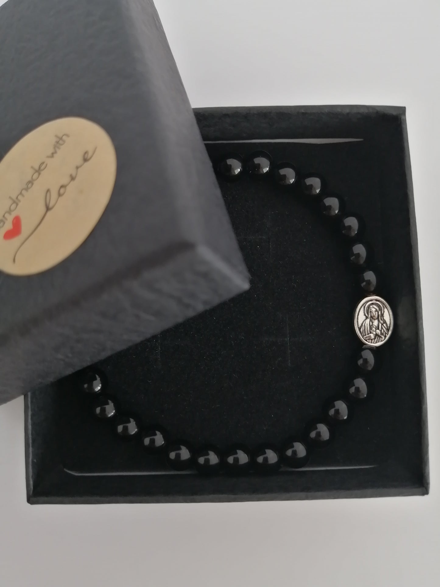 Zwarte agaat armband met religieuze accessoire